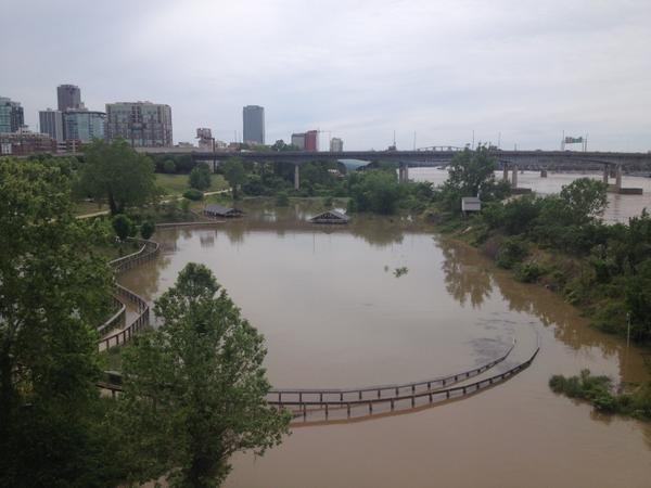 FILE - The William E. "Bill" Clark Wetlands by the Arkansas River floods Tuesday, May 12, 2015, after a storm system dropped more than eight inches of rain across the state. 