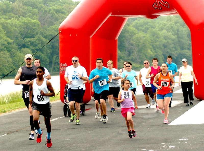 Photo by Mike Eckels Runners start their take off roll down runway 31 at Crystal Lake Air Park during the first annual &#8220;Come Fly With Me&#8221; 5K and color run in 2014. This year&#8217;s event is scheduled for May 16.