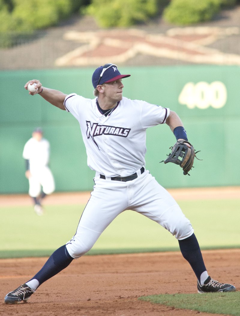 Third baseman Hunter Dozier throws a runner out against the San Antonio Missions at Arvest Ballpark in Springdale, AR on Friday, August 10, 2014. 