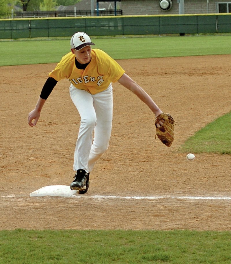 NWA Democrat-Gazette/MARK HUMPHREY Logan Gragg, Prairie Grove junior, fields a ground ball at third base against Farmington earlier this season. Gragg led the Tigers on a postseason run with his arm and bat as Prairie Grove heads to the Class 4A state tournament today against Arkadelphia in Blytheville.