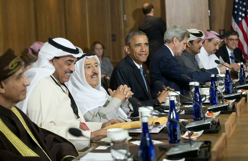 President Barack Obama sits with Kuwaiti Emir Sheikh Sabah Al-Ahmad Al-Sabah (center) and Gulf Cooperation Council leaders and delegates Thursday at Camp David in Maryland, where Obama promised that the United States is committed to the security of its Persian Gulf allies. 