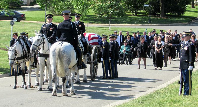 Mourners follow the coffin of Army Master Sgt. James Holt on Thursday at Arlington National Cemetery. The Hope native died in 1968 in Vietnam; his remains were identified using DNA.
