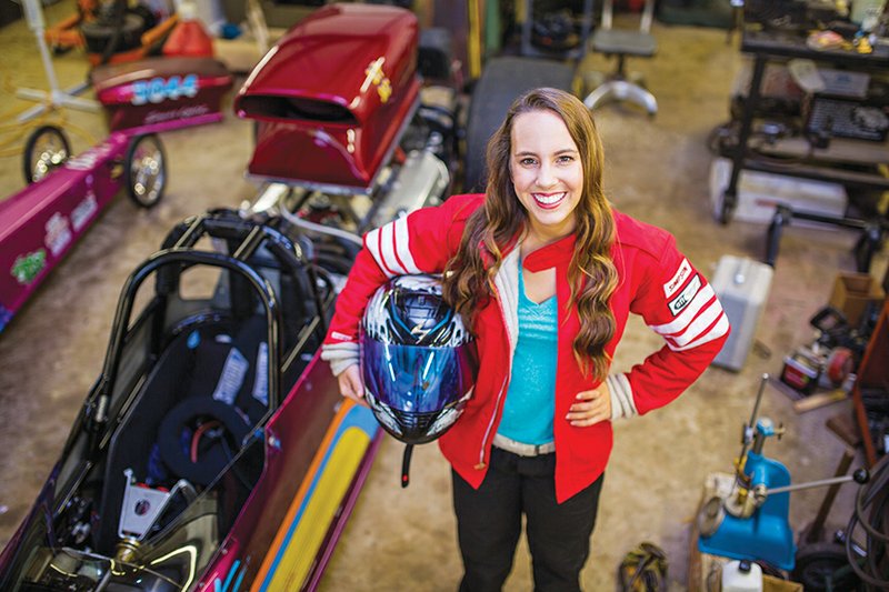 Madelyn Roper, 19, of Conway stands by her dragster in her grandfather Bobby Roper’s shop in the Toad Suck community. The teenager grew up around racing because her grandfather raced for many years and taught her everything he knew. “I want to be just like him,” she said. Madelyn said she wants to race a top-fuel dragster someday. She’s also a student at the University of Arkansas Community College at Morrilton.