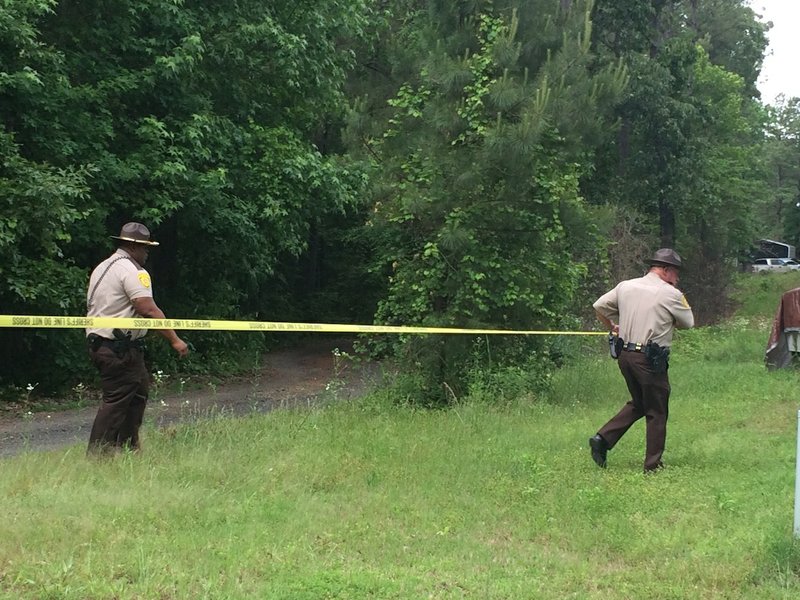 Jefferson County sheriff's office deputies put up crime scene tape on Friday, May 15, 2015 at the scene of a shooting in Redfield that left one child critically injured.