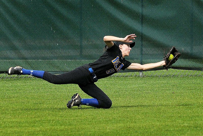 North Little Rock center fielder Reagan Sperling dives to catch a fly ball during Friday’s 2-0 second-round victory over Rogers in the Class 7A state softball tournament at Veterans Park in Rogers.