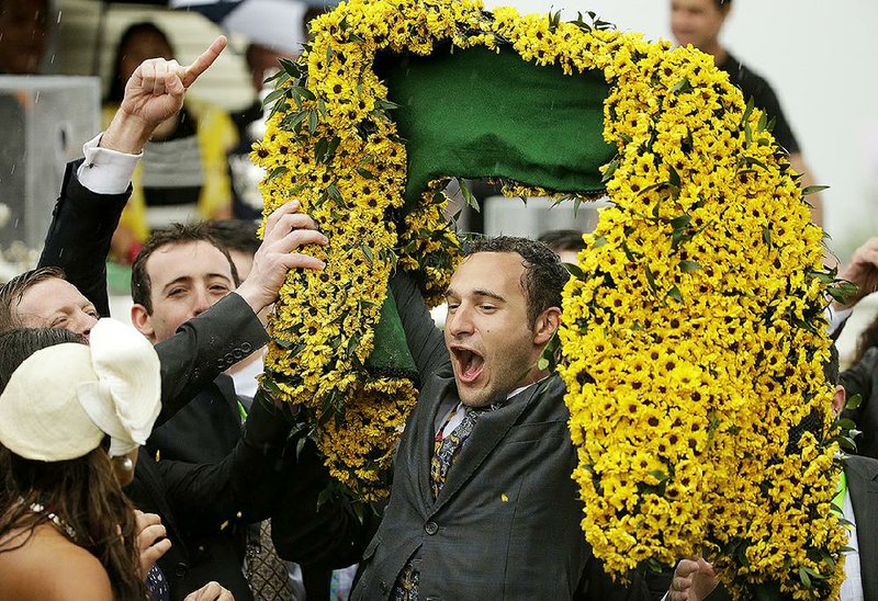 Justin Zayat, son of American Pharoah owner Ahmed Zayat, celebrates after Pharoah won the Preakness on Saturday. Zayat, who serves as the stable’s racing and stallion manager, is also a student at New York University, and had to complete two final exams Thursday before heading to Pimlico. 