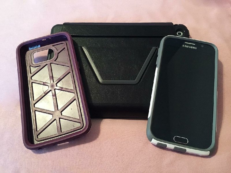 The Otterbox Symmetry (left) and Commuter (right) cases are designed to protect the new Samsung Galaxy S6 from drops and dust. The Symmetry Folio (center) protects the iPad Air 2 or iPad Mini and doubles as a stand. 