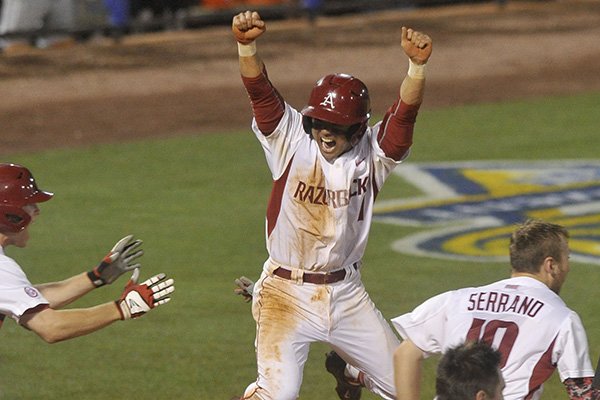 Arkansas' Rick Nomura celebrates after scoring the game-winning run in the ninth inning of an SEC Tournament game against Tennessee on Tuesday, May 19, 2015, at Hoover Metropolitan Stadium in Hoover, Ala. 