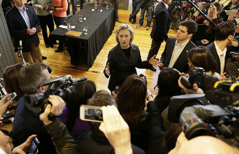 Democratic presidential candidate Hillary Rodham Clinton speaks to the media after meeting with small-business owners Tuesday at the Bike Tech cycling shop in Cedar Falls, Iowa.