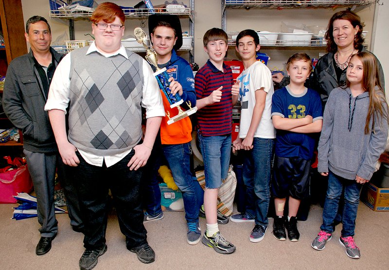 Jeff Della Rosa/Special to Siloam Sunday The Siloam Springs Middle School OM team and coaches met Wednesday to practice the performance for the competition at World Finals in Michigan this week. From left, coach Gary Davidson, Max Ketcher, Theron Perkins, Drew Smith, Joseph Connett, Bailey Schmidt, coach Lisa Smith and China Davidson. Andrea Ketcher, not in the picture, is also a coach for the team.