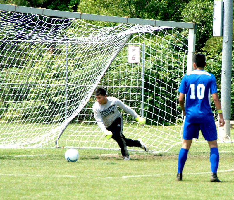 Photo by James Garner Tony Mendoza (Decatur #10) slips the ball past the Cossatot River goalie for the first of two goals he scored during the first round of the high school soccer tournament at Central Arkansas Christian in North Little Rock on May 14. The Bulldogs held the Eagles to one goal as they took the match, 2 to 1.