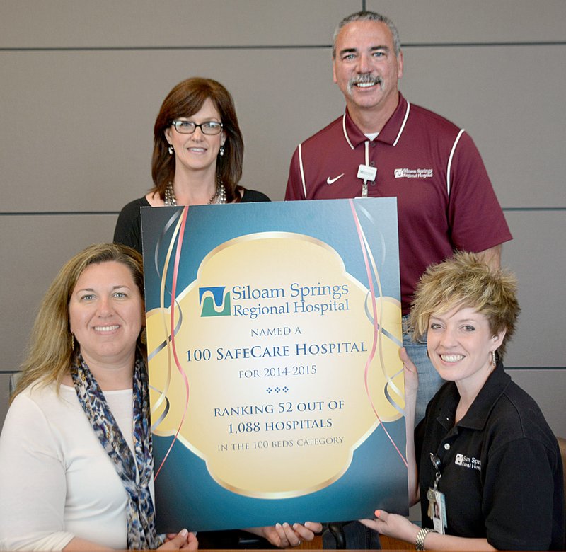 Janelle Jessen/Herald-Leader Siloam Springs Regional Hospital was recognized as one of the 100 SafeCare Hospitals for the 2014-2015 year. Pictured, from left, are Maria Wleklinski, chief nursing officer; Kathy Gilbow, director of quality and risk management; Kevin Clement, chief executive officer; and Cathy Davis, director of marketing.
