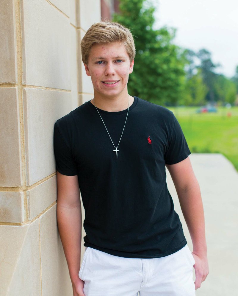 Matt Sweere stands outside Conway High School. The 17-year-old junior made a 36 on the ACT — the highest composite score attainable. He said he made several 35s before getting the perfect score. He had an extra incentive from his parents, who agreed to buy him a Dodge Challenger if he made the top score.