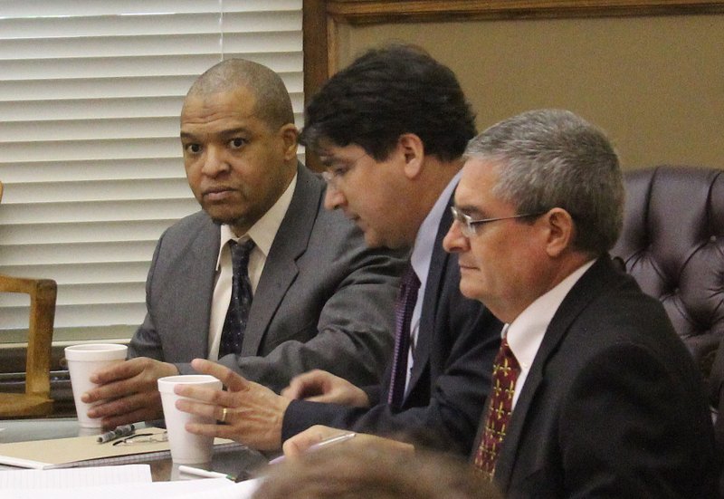 Darrell Dennis, left, sits with his attorney on Wednesday, May 20, 2015, on the opening day of his capital murder trial in Pulaski County Circuit Court.