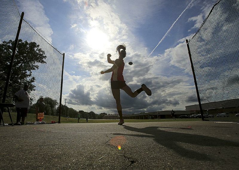 Cabot’s Tori Weeks throws the discus Wednesday during the first day of competition at the state high school heptathlon at Cabot High School. Tori Weeks is third behind twin sister Lexi and Little Rock Parkview’s Jada Baylark. 
