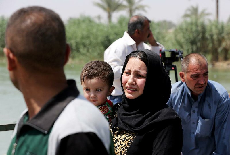 Displaced Iraqis fleeing Islamic State militants in Ramadi cross Wednesday into Baghdad province after being granted conditional entry, a provincial official said.