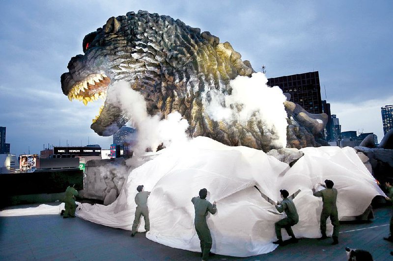 Godzilla’s head is unveiled atop an office of Toho Co., the Japanese movie studio behind the original 1954 film of the irradiated monster, in Tokyo’s Shinjuku ward in April.