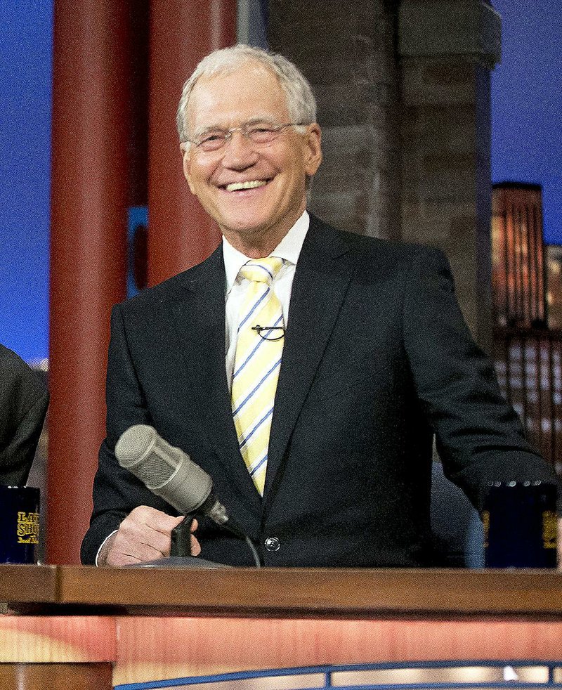 In this May 4, 2015 file photo, host David Letterman smiles during a break at a taping of  "The Late Show with David Letterman," at the Ed Sullivan Theater in New York. After 33 years in late night and 22 years hosting CBS' "Late Show," Letterman will retire on May 20. 