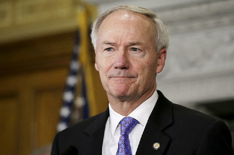 Arkansas Gov. Asa Hutchinson listens to a reporter's question during a news conference at the Arkansas state Capitol in Little Rock, Ark., Monday, April 6, 2015. 