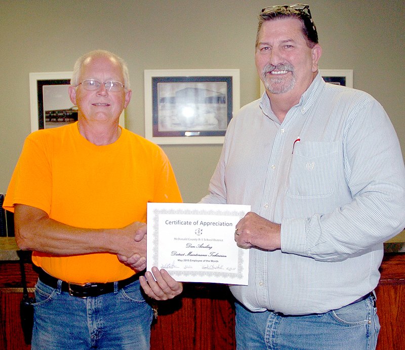 RICK PECK MCDONALD COUNTY PRESS Dan Ameling (left) was presented a certificate by Bob Campbell on May 14 for being named the Employee of the Month by the McDonald County School District. Ameling has worked in the district&#8217;s maintenance department for eight years.