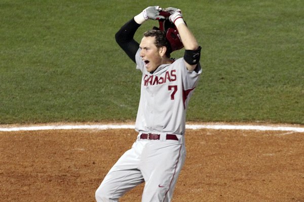 Arkansas’s Bobby Wernes (7) celebrates as he crosses home plate after hitting a two run homer to go ahead of Florida during the ninth inning of a game at the Southeastern Conference college baseball tournament at the Hoover Met, Thursday, May 21, 2015, in Hoover, Ala. (AP Photo/Butch Dill)
