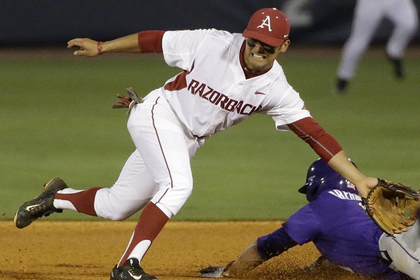 LSU's Alex Bregman steals second base against Arkansas' Rick Nomura during the first inning of a Southeastern Conference college baseball tournament game Thursday, May 21, 2015, in Hoover, Ala. (AP Photo/Brynn Anderson)