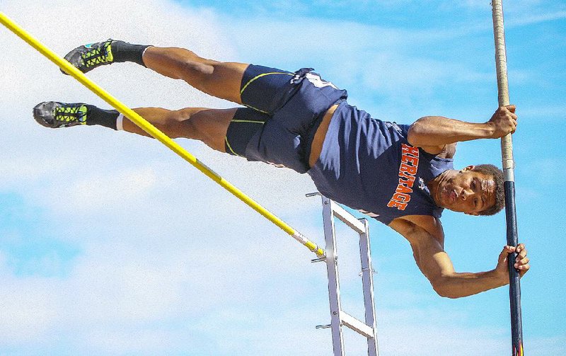 Rogers Heritage’s Joey Saucier clears 10 feet, 6 inches in the pole vault at the state decathlon Thursday at Cabot. Saucier finished 10th in the event but won the overall title, scoring 6,012 points to hold off Donell West of Lake Hamilton.