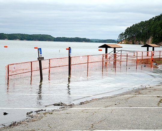 The Sentinel-Record/Mara Kuhn FLOODED CAMPSITE: Rising water on Lake Ouachita as caused the U.S. Corps of Engineers to close several campsites, such as this one at Brady Mountain Recreation Area. More rain is predicted through the Memorial Day weekend.