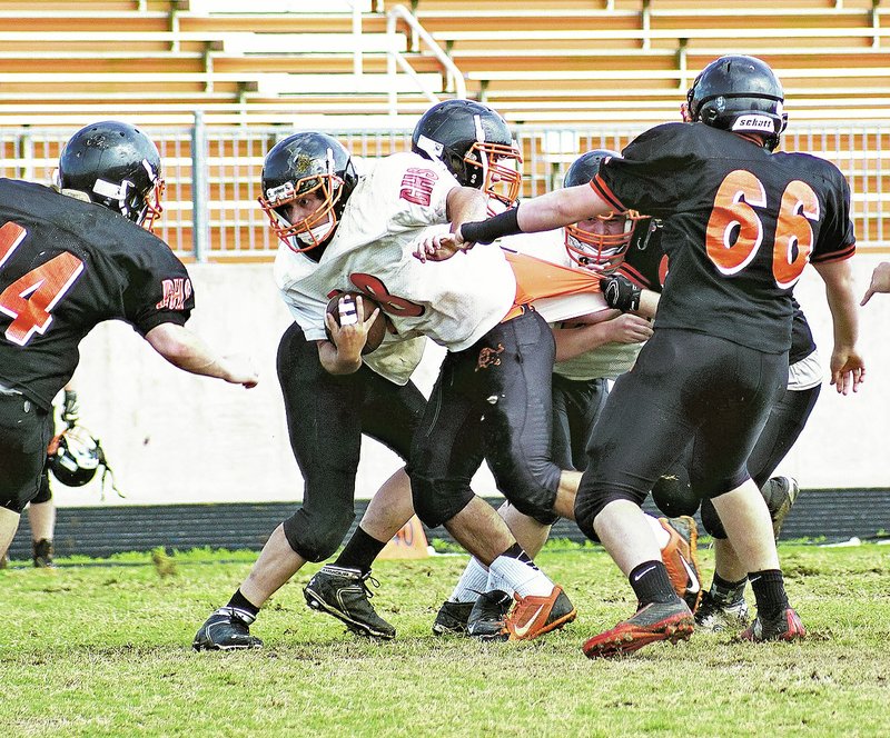  NWA Democrat-Gazette/RANDY MOLL Jordan Burnett carries the ball for the white team as he is the orange and white game in Gravette on Thursday.