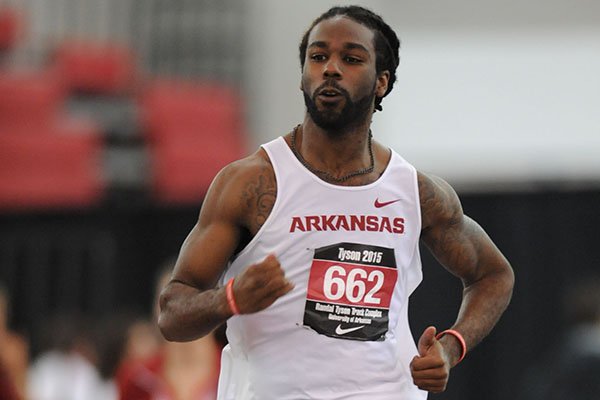 Eric Hawkins of Arkansas runs while competing in the 200 meters during the Tyson Invitational Saturday, Feb. 14, 2015, at the Randal Tyson Track Center in Fayetteville.