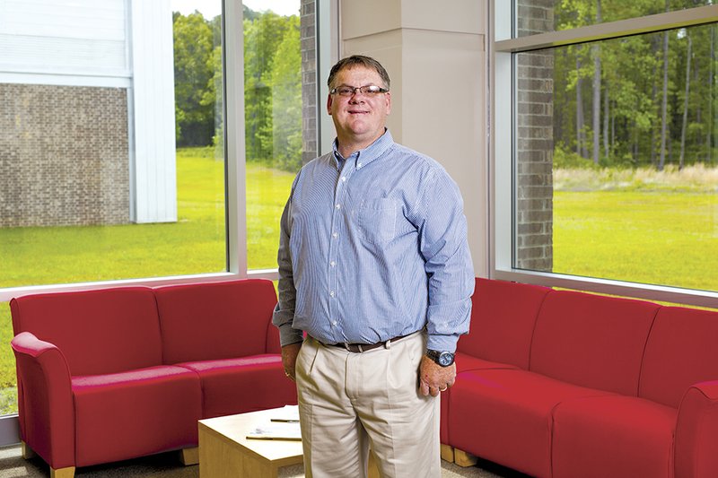 Heber Springs Parks and Recreation Director Stacey Mills stands in the community center. He said one of his goals is to expand the membership of the 6-year-old facility, which includes an aquatic center.