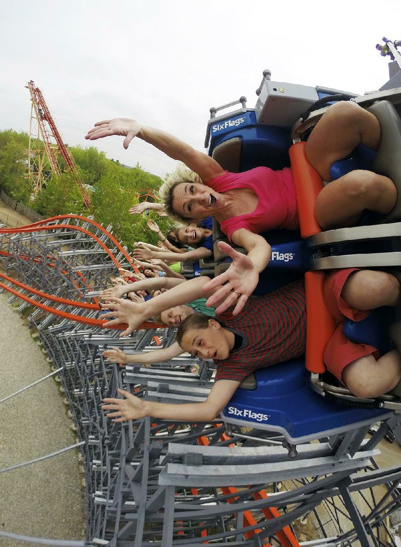 People ride the Wicked Cyclone in Agawam, Mass. on May 16. A handful of roller coasters are reopening this year after undergoing extensive rehabs. 