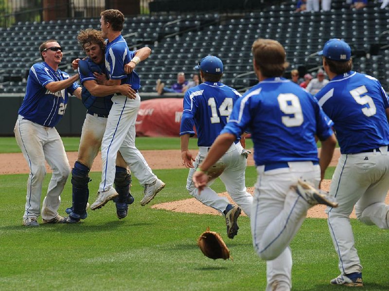 Harrison catcher Tel Parker (second from left) celebrates with teammates after the Goblins held off White Hall for a 2-1 victory Saturday in the Class 5A baseball state championship game at Baum Stadium in Fayetteville. More photos are available at arkansasonline.com/galleries. 