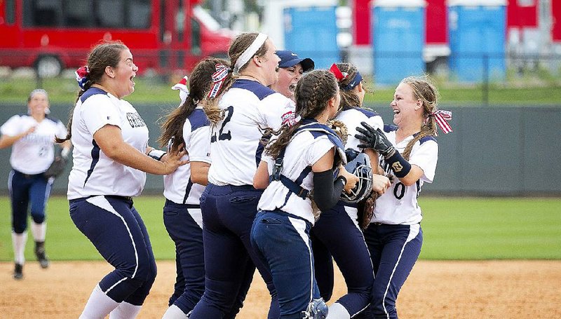 Greenwood players celebrate with pitcher Victoria Taylor (second from right) after defeating Sheridan 3-0 Saturday in the Class 6A softball state championship at Bogle Park in Fayeteville. Taylor gave up two hits and was named the game’s MVP. More photos are available at arkansasonline.com/galleries. 