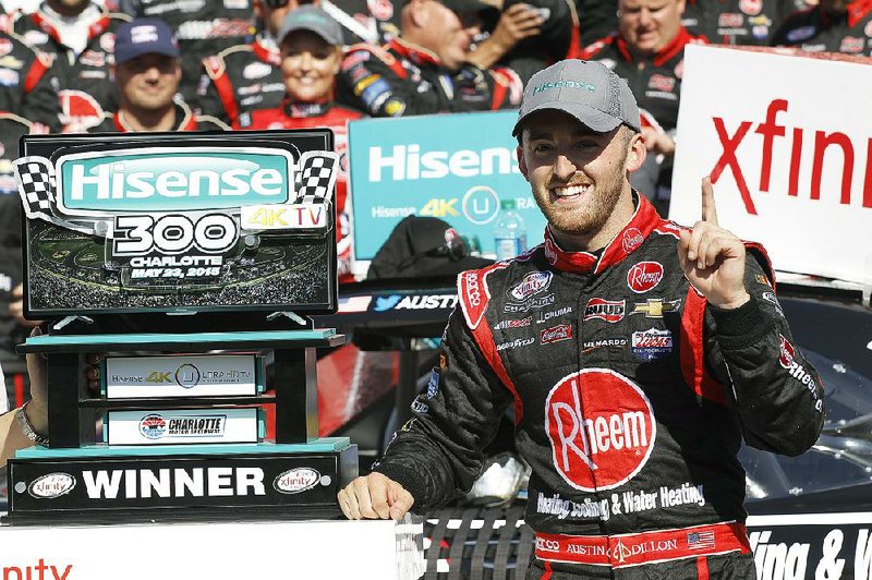 Austin Dillon celebrates in Victory Lane after winning the NASCAR Xfinity series auto race at Charlotte Motor Speedway in Concord, N.C., Saturday, May 23, 2015.