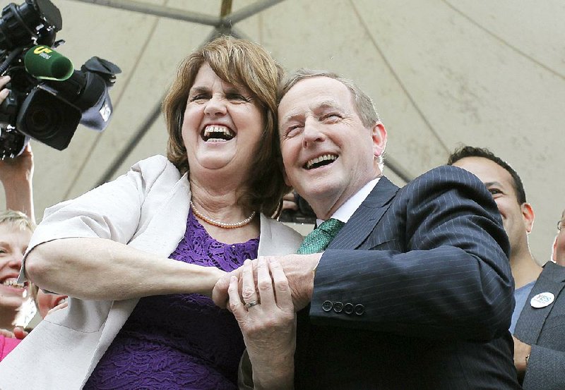 Irish Prime Minister Enda Kenny and Deputy Prime Minister Joan Burton celebrate Saturday at Dublin Castle after the referendum on legalizing same-sex marriage passed resoundingly. 