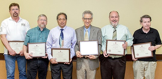 Submitted photo Henderson State University in Arkadelphia honored faculty members for their years of service during a ceremony held April 16 in the Garrison Center Banquet Room. The university's 25-year honorees, from left, were Lonnie McDonald, professor of curriculum and instruction; John Long, professor and chair of the department of Chemistry; Haroon Khan, professor of political science; Martin Halpern, professor of history; Jim Buckner, professor and chair of the department of Music; and Stuart Shaw, professor of geography. Not pictured is Renn Tumlison, professor of biology.