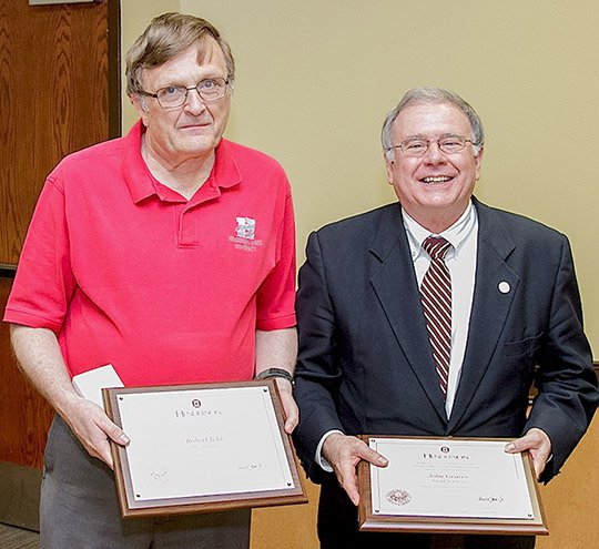 Submitted photo Faculty members at Henderson State University in Arkadelphia were honored for their years of service on April 16 during a ceremony in the Garrison Center Banquet Room. The faculty's 30-year honorees, from left, were Bob Yehl, library director and associate librarian, and John Graves, professor of history and chair of the department of Social Sciences.