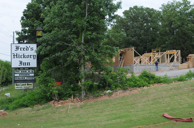 NWA Democrat-Gazette/FLIP PUTTHOFF Fred&#8217;s Hickory Inn is being rebuilt at 1502 N. Walton Blvd.