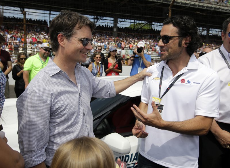 Pace car driver Jeff Gordon, left, talks with former Indy 500 champion Dario Franchitti before driving the pace car for the 99th running of the Indianapolis 500 auto race at Indianapolis Motor Speedway in Indianapolis, Sunday, May 24, 2015.