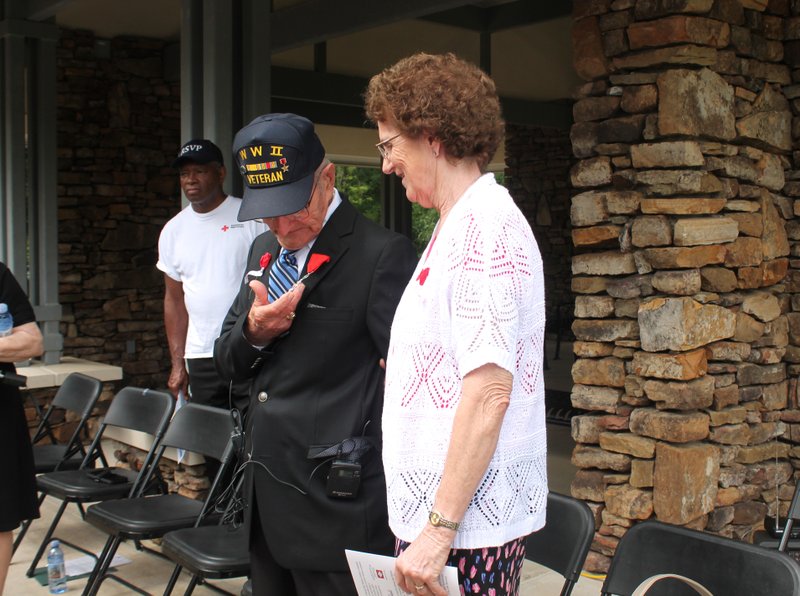 Harold Kindrick stands with his wife, Melvalea Kindrick, at the Arkansas State Veterans Cemetery after he received the French Legion of Honor, France's highest distinction, for his service in WWII.