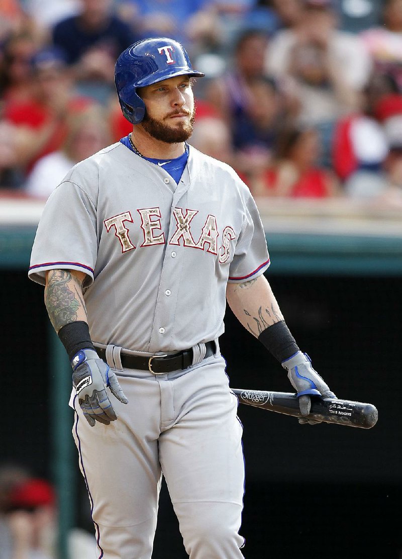 Texas outfielder Josh Hamilton was 0 for 3 with 2 strikeouts and 1 walk in his first game back with the Rangers on Monday. Texas still managed to beat Cleveland 10-8 for its sixth victory in a row.