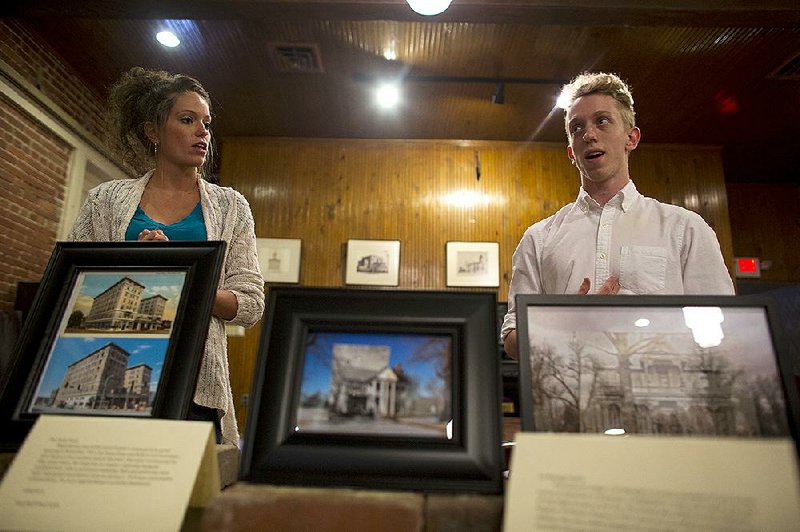 Amethyst Schmued and brother Calvert Schmued discuss their project on historical photo re-creations last week in downtown Pine Bluff. The siblings are showing their work at the Jefferson County Historical Museum to bring Pine Bluff and its needs to the attention of the community. 