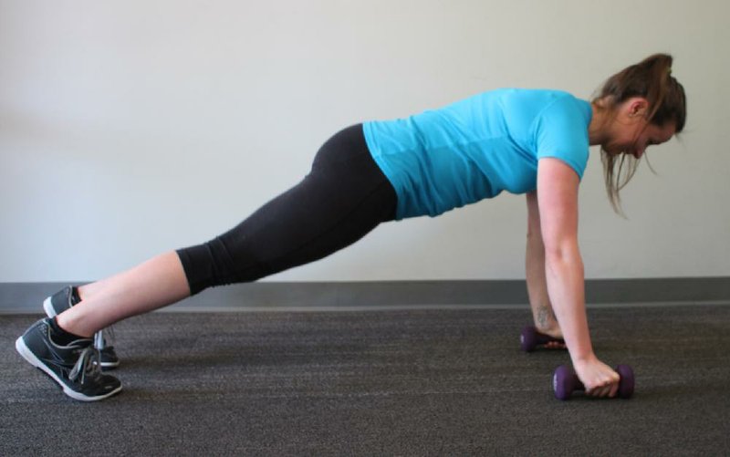 Anna Bolte  does the first, third and fifth steps of the Pushup Hammer Curl  exercise for Matt Parrot's Master Class exercise of the week. She uses lighter dumbbells than she would normally curl, to protect her back.