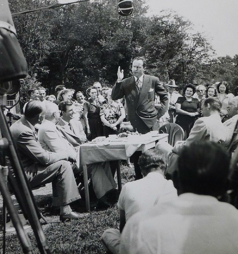 Arkansas Gov. Sid McMath (center) speaks during a scene in the movie Wonder Valley, which was filmed in 1951 in Cave Springs and Springdale. The original photo by Hubert L. Musteen of Rogers was provided by the Special Collections Department of the University of Arkansas Libraries in Fayetteville.
