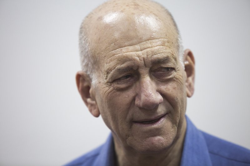 Former Israeli Prime Minister Ehud Olmert attends his trial at the Jerusalem District Court, Monday, May 25, 2015. Olmert was sentenced Monday to eight months in prison for unlawfully accepting money from a U.S. supporter, capping the dramatic downfall of a man who only years earlier led the country and hoped to bring about a historic peace agreement with the Palestinians.