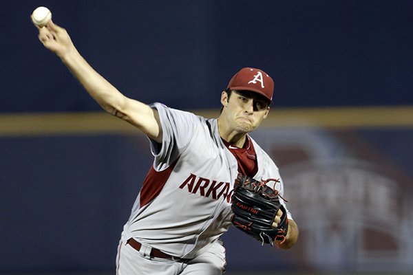 Arkansas’ Keaton McKinney pitches against Florida during the first inning of a Southeastern Conference college baseball tournament game Wednesday, May 20, 2015, in Hoover, Ala. (AP Photo/Butch Dill)