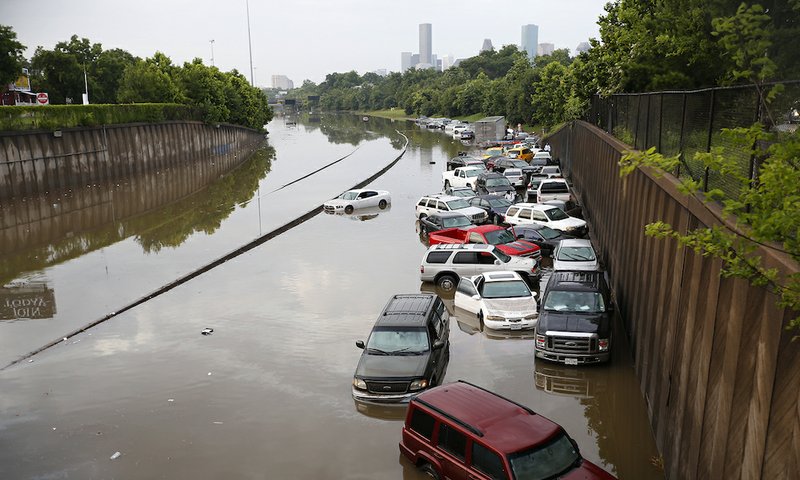 Motorists are stranded along I-45 along North Main in Houston after storms flooded the area, Tuesday, May 26, 2015. Overnight heavy rains caused flooding closing some portions of major highways in the Houston area. 