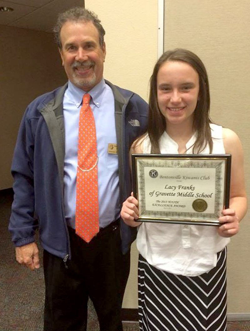 Submitted Photo Lacy Franks received the Bentonville Kiwanis Club 2015 Youth Excellence Award. She is pictured with middle school principal Duane Thomas.