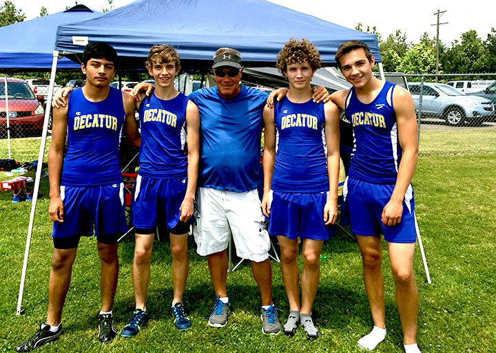 Submitted Photo The Decatur 4x800-meter relay team placed first in the state 2A meet at Gurdon May 6. Pictured are Marck Guardarrama (left), Taylor Haisman, Coach Shane Holland, Ryan Shaffer and Tyler Riddle in a tie of 8:52.69, nearly two minutes off number two finisher Eureka Springs.